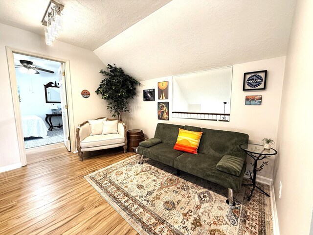 512 Riverview Dr, Franklin, TN 37064 - living area featuring wood finished floors, ceiling fan, a textured ceiling, lofted ceiling, and baseboards