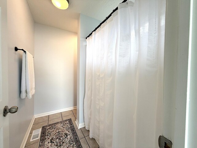 512 Riverview Dr, Franklin, TN 37064 - full bathroom featuring tile patterned floors, a shower with shower curtain, and baseboards