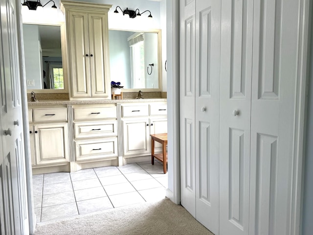 512 Riverview Dr, Franklin, TN 37064 - bathroom with a closet, double vanity, tile patterned flooring, and plenty of natural light