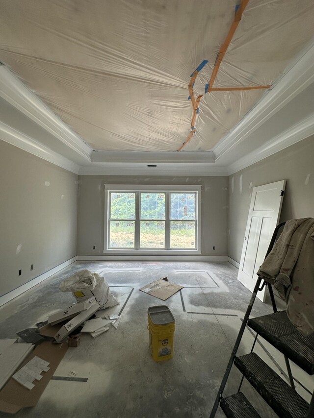 887 Ovoca Lake Rd, Tullahoma, TN 37388 - unfurnished living room featuring a raised ceiling, crown molding, and baseboards