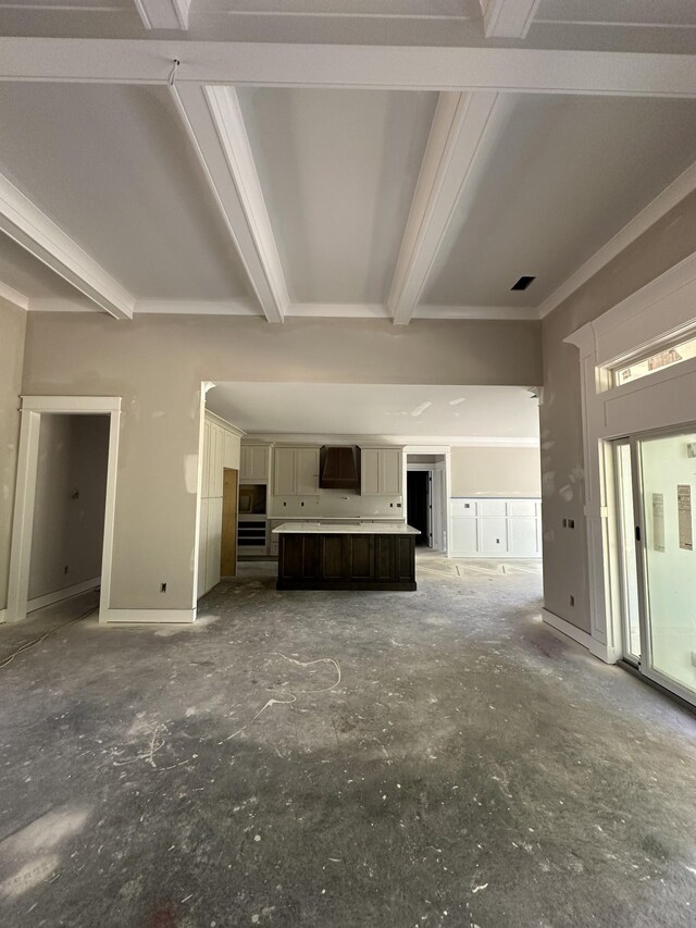 887 Ovoca Lake Rd, Tullahoma, TN 37388 - unfurnished living room featuring beamed ceiling, baseboards, and ornamental molding