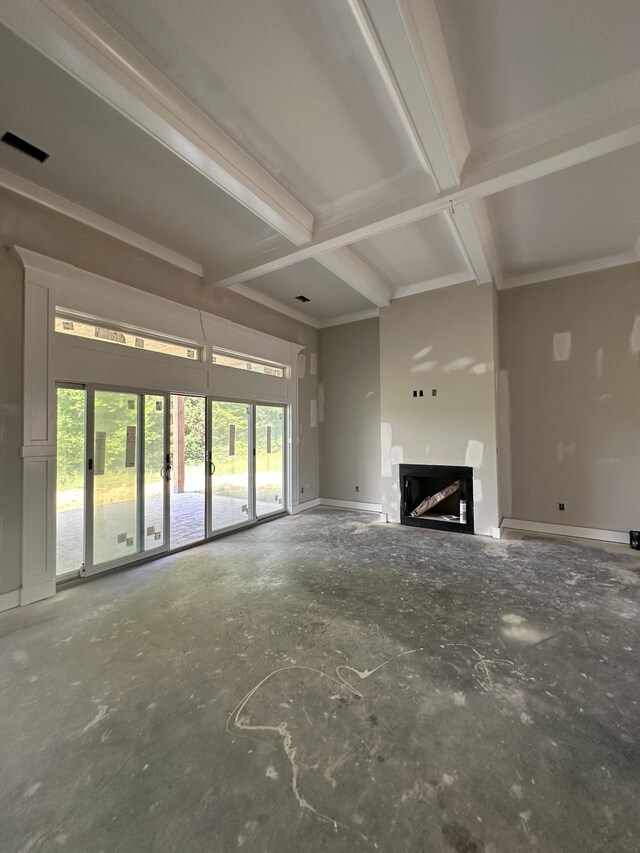 887 Ovoca Lake Rd, Tullahoma, TN 37388 - unfurnished living room featuring a fireplace, beamed ceiling, and baseboards