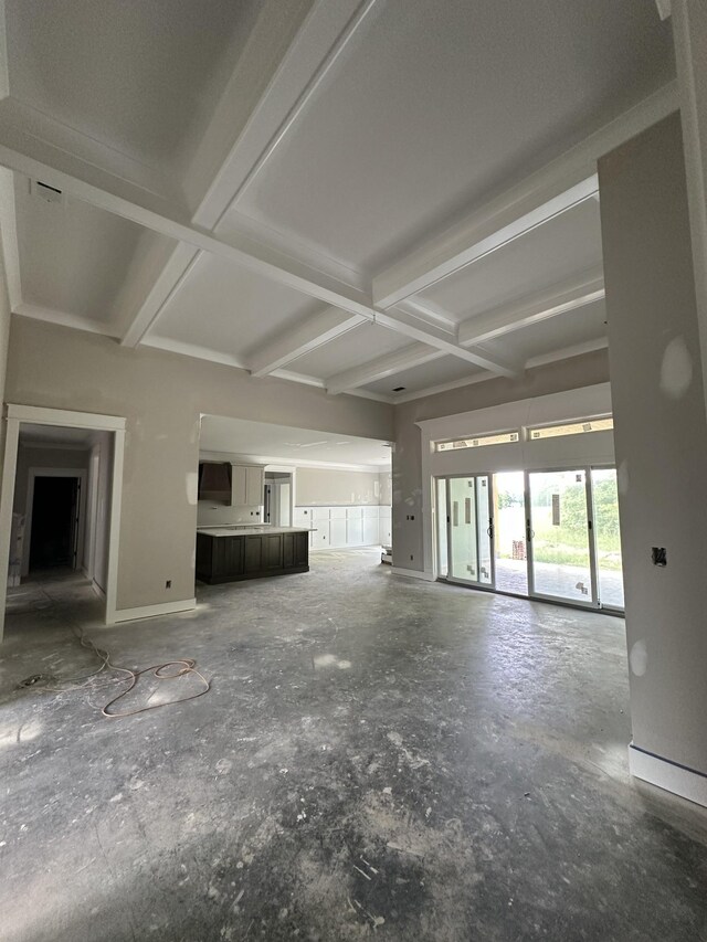 887 Ovoca Lake Rd, Tullahoma, TN 37388 - unfurnished living room with coffered ceiling, beam ceiling, and baseboards