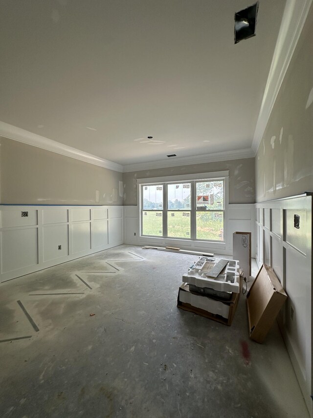 887 Ovoca Lake Rd, Tullahoma, TN 37388 - living room with ornamental molding, wainscoting, a decorative wall, and concrete floors