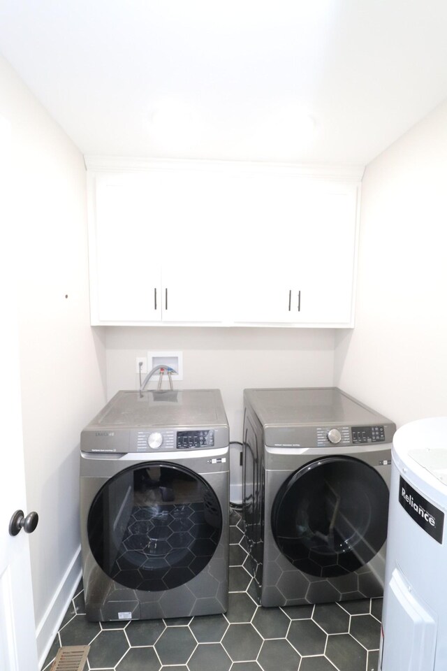 214 Miller Rd, Lafayette, TN 37083 - washroom with washing machine and dryer, cabinet space, tile patterned floors, and baseboards