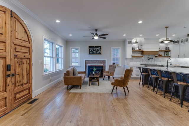 103 Maple St, Smyrna, TN 37167 - living room featuring baseboards, recessed lighting, ornamental molding, light wood-style flooring, and ceiling fan