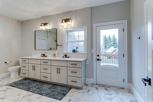 103 Maple St, Smyrna, TN 37167 - bathroom featuring double vanity, marble finish flooring, toilet, and baseboards