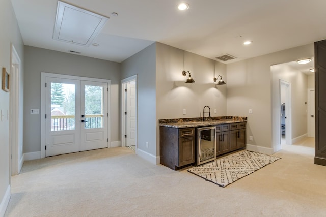 103 Maple St, Smyrna, TN 37167 - kitchen with light carpet, wine cooler, baseboards, and recessed lighting