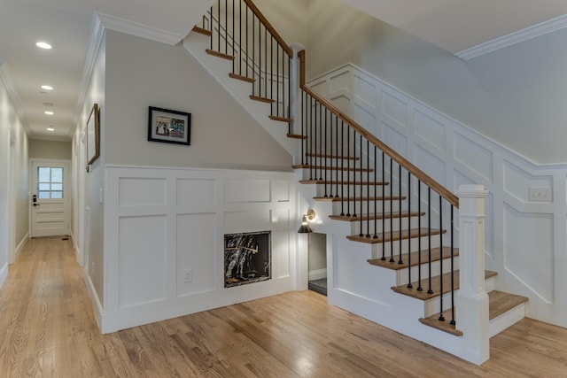 103 Maple St, Smyrna, TN 37167 - stairs with a decorative wall, ornamental molding, wood finished floors, a fireplace, and recessed lighting