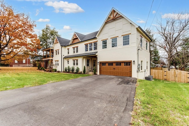 103 Maple St, Smyrna, TN 37167 - townhome / multi-family property with asphalt driveway, an attached garage, a standing seam roof, roof with shingles, and stucco siding
