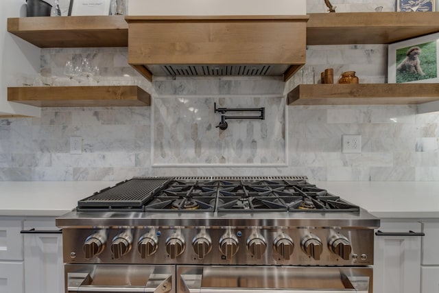 103 Maple St, Smyrna, TN 37167 - kitchen with open shelves, stainless steel stove, light countertops, premium range hood, and backsplash