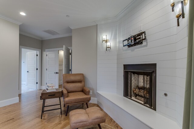 103 Maple St, Smyrna, TN 37167 - sitting room with light wood finished floors, baseboards, crown molding, recessed lighting, and a large fireplace