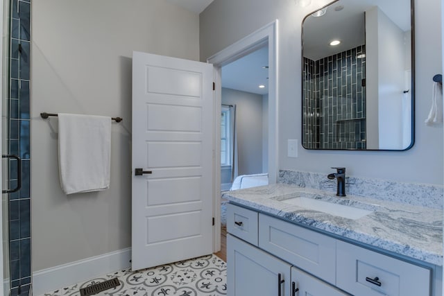 103 Maple St, Smyrna, TN 37167 - bathroom featuring vanity, a tile shower, tile patterned floors, baseboards, and recessed lighting