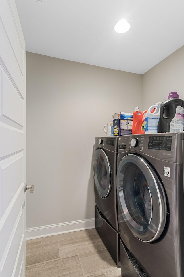 5124 Southfork Blvd, Old Hickory, TN 37138 - laundry room with washer and clothes dryer, baseboards, and light wood-style floors