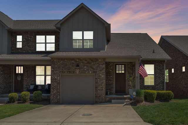 5124 Southfork Blvd, Old Hickory, TN 37138 - view of front of property featuring board and batten siding, a garage, driveway, and roof with shingles