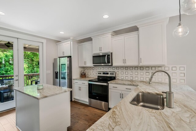 5124 Southfork Blvd, Old Hickory, TN 37138 - kitchen featuring appliances with stainless steel finishes, a sink, decorative backsplash, white cabinets, and dark wood-type flooring