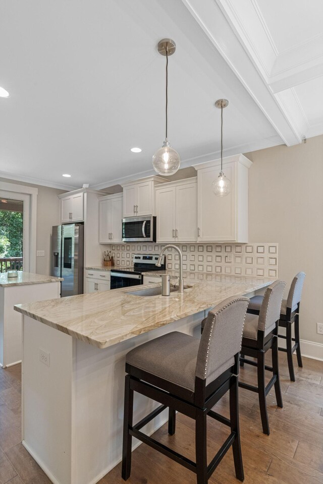 5124 Southfork Blvd, Old Hickory, TN 37138 - kitchen featuring stainless steel appliances, a peninsula, a sink, tasteful backsplash, and white cabinets