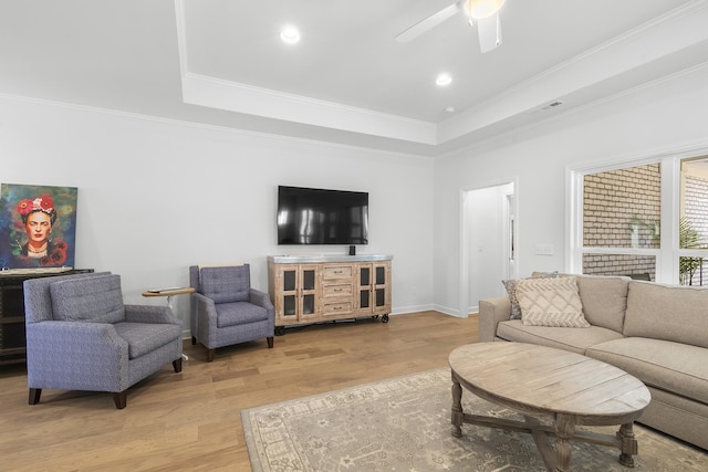 7428 Dodd Retreat Ct, Hermitage, TN 37076 - living area with a tray ceiling, light wood-type flooring, ceiling fan, crown molding, and recessed lighting