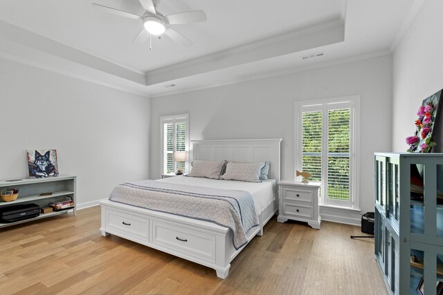 7428 Dodd Retreat Ct, Hermitage, TN 37076 - bedroom featuring a raised ceiling, light wood-style floors, crown molding, and multiple windows