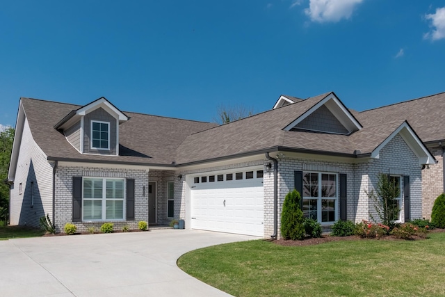 7428 Dodd Retreat Ct, Hermitage, TN 37076 - view of front of house with brick siding, driveway, a garage, a front yard, and roof with shingles