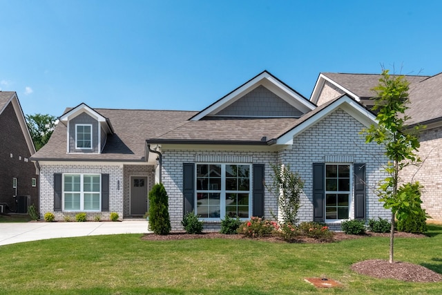 7428 Dodd Retreat Ct, Hermitage, TN 37076 - view of front facade with brick siding, a front yard, and a shingled roof