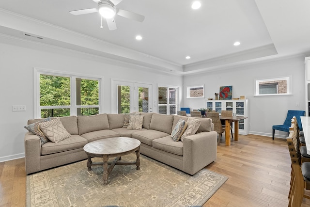 7428 Dodd Retreat Ct, Hermitage, TN 37076 - living area featuring a tray ceiling, recessed lighting, baseboards, crown molding, and light wood-style floors