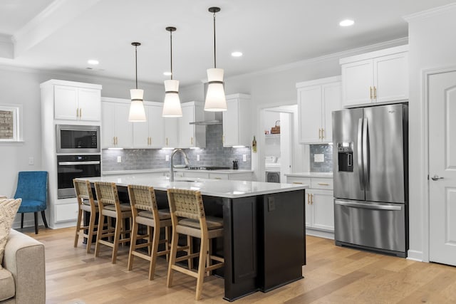 7428 Dodd Retreat Ct, Hermitage, TN 37076 - kitchen with appliances with stainless steel finishes, a sink, tasteful backsplash, white cabinetry, and crown molding