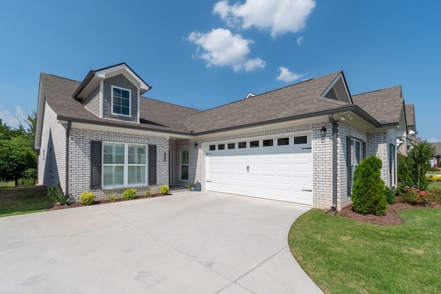 7428 Dodd Retreat Ct, Hermitage, TN 37076 - view of front of house with brick siding, a garage, concrete driveway, roof with shingles, and a front lawn