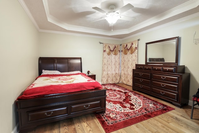 304 Baronswood Dr, Nolensville, TN 37135 - bedroom with a tray ceiling, wood finished floors, ornamental molding, and a ceiling fan