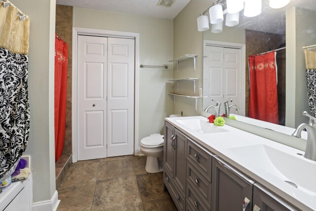 304 Baronswood Dr, Nolensville, TN 37135 - bathroom with double vanity, toilet, a shower with shower curtain, and stone finish floors