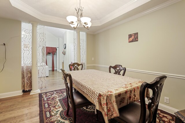 304 Baronswood Dr, Nolensville, TN 37135 - dining space featuring ornate columns, light wood-style flooring, ornamental molding, a chandelier, and baseboards