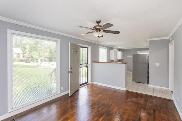 125 Neese Dr, Nashville, TN 37211 - unfurnished living room with light wood-style flooring, baseboards, crown molding, and ceiling fan
