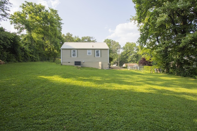 125 Neese Dr, Nashville, TN 37211 - back of house with central AC unit, a lawn, and metal roof