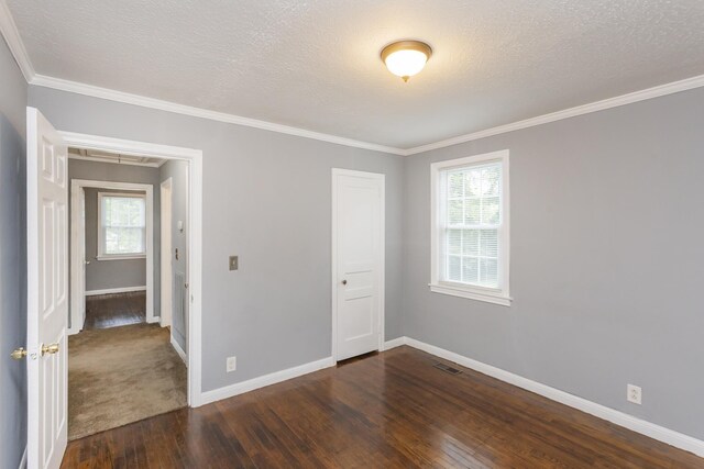125 Neese Dr, Nashville, TN 37211 - unfurnished bedroom featuring attic access, dark wood-style flooring, multiple windows, baseboards, and crown molding