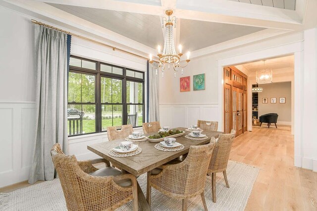 1 Old S Rd, Murfreesboro, TN 37128 - dining space with a chandelier, a decorative wall, a wainscoted wall, and light wood finished floors