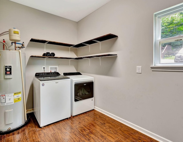 2639 Distillery Rd, Greenbrier, TN 37073 - laundry room with water heater, separate washer and dryer, wood finished floors, and baseboards