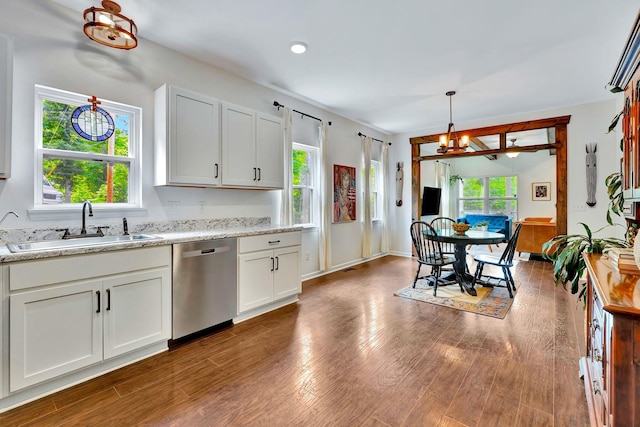 2639 Distillery Rd, Greenbrier, TN 37073 - kitchen featuring dishwasher, a sink, wood finished floors, white cabinets, and a chandelier