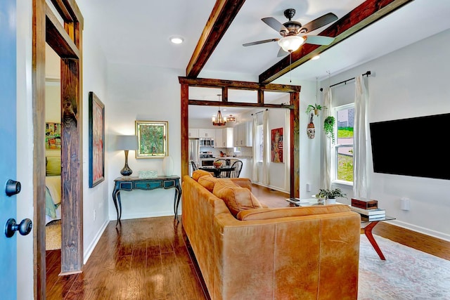 2639 Distillery Rd, Greenbrier, TN 37073 - living area featuring beam ceiling, wood finished floors, a chandelier, ceiling fan, and baseboards