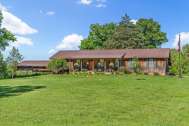 2890 Nance Bend Rd, Clifton, TN 38425 - view of front of house featuring a front lawn, metal roof, board and batten siding, and covered porch