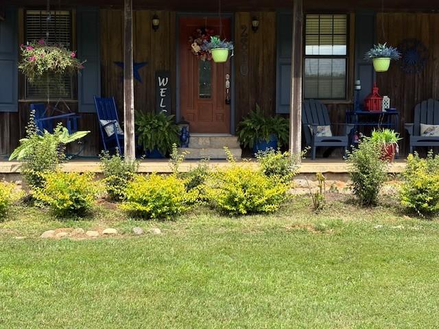 2890 Nance Bend Rd, Clifton, TN 38425 - view of exterior entry with a yard and a porch