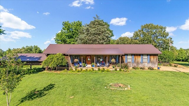 2890 Nance Bend Rd, Clifton, TN 38425 - ranch-style home featuring a front yard, metal roof, and board and batten siding