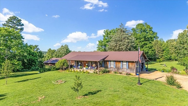 2890 Nance Bend Rd, Clifton, TN 38425 - single story home with a front yard, dirt driveway, covered porch, and metal roof