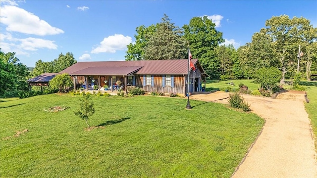 2890 Nance Bend Rd, Clifton, TN 38425 - ranch-style house featuring dirt driveway, a front lawn, a porch, and metal roof