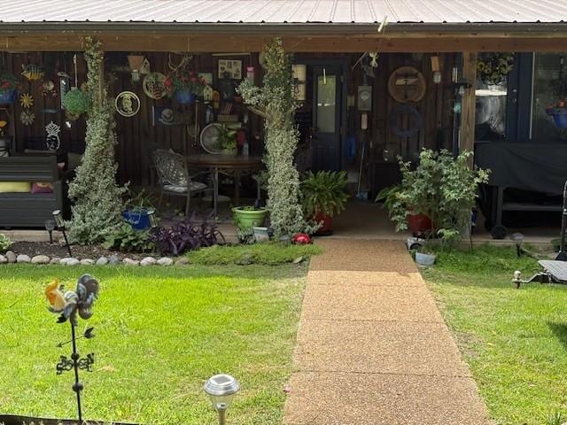 2890 Nance Bend Rd, Clifton, TN 38425 - property entrance featuring metal roof and a lawn