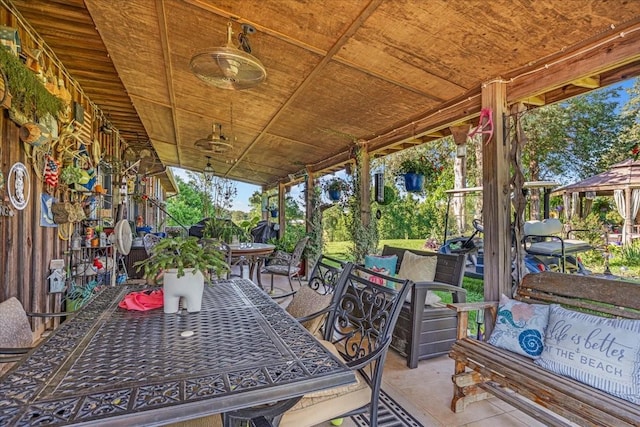 2890 Nance Bend Rd, Clifton, TN 38425 - view of patio with outdoor dining space and an outdoor living space