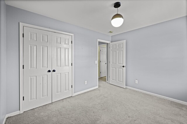 5009 Lanier Dr, Greenbrier, TN 37073 - unfurnished bedroom featuring carpet, baseboards, and a closet