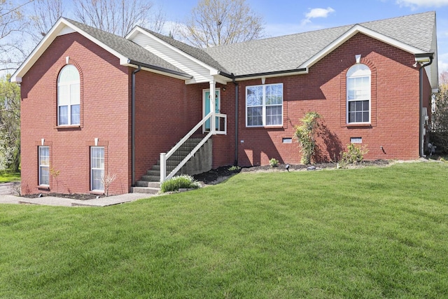 5009 Lanier Dr, Greenbrier, TN 37073 - back of house with brick siding, roof with shingles, and a lawn