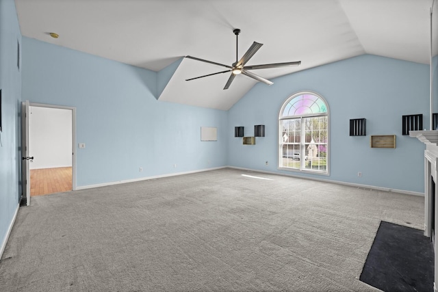 5009 Lanier Dr, Greenbrier, TN 37073 - unfurnished living room with carpet flooring, lofted ceiling, a ceiling fan, a fireplace with flush hearth, and baseboards
