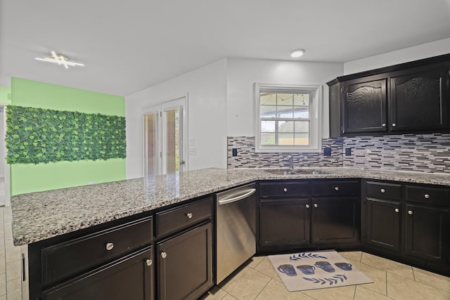 5009 Lanier Dr, Greenbrier, TN 37073 - kitchen with dishwasher, a sink, tasteful backsplash, and light stone countertops