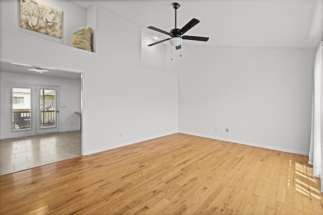 5009 Lanier Dr, Greenbrier, TN 37073 - empty room with wood finished floors, a ceiling fan, high vaulted ceiling, and baseboards
